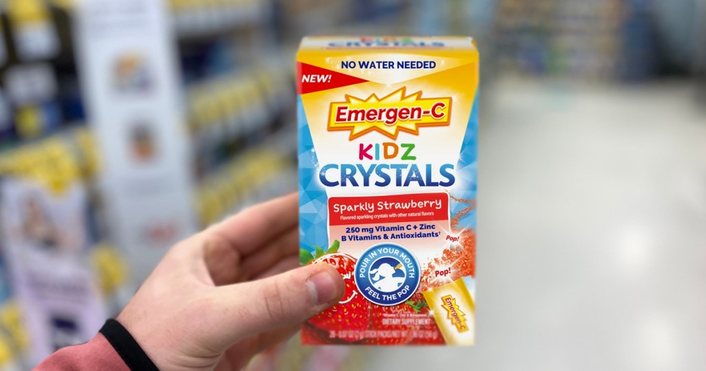 hand holding up a box of Emergen-C Kidz Crystals