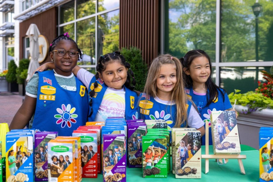 A group of girl scouts selling cookies during cookie season 2025