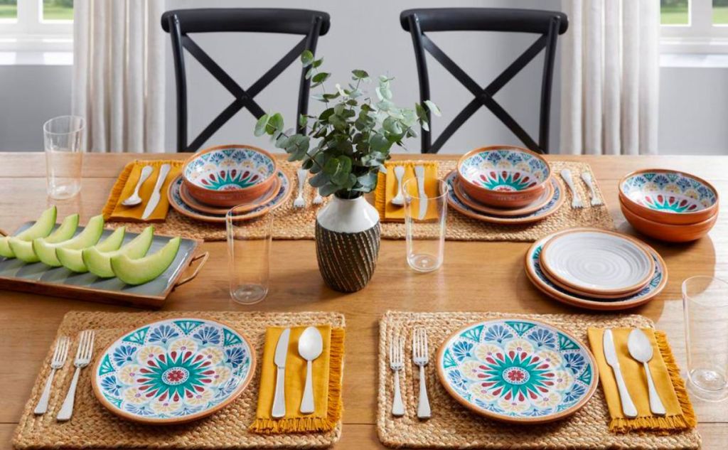 Home Decorators Collection Azria Melamine Dinnerware set up on a dining table with fresh honey dew melon