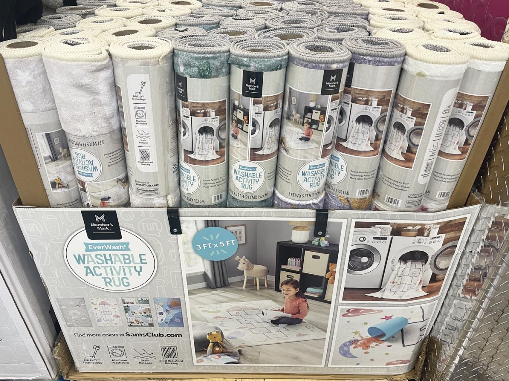 rolled up washable kids rugs in store display 