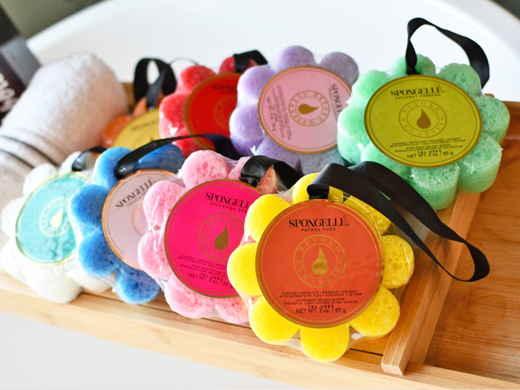 colorful flower shaped sponges on bath tray