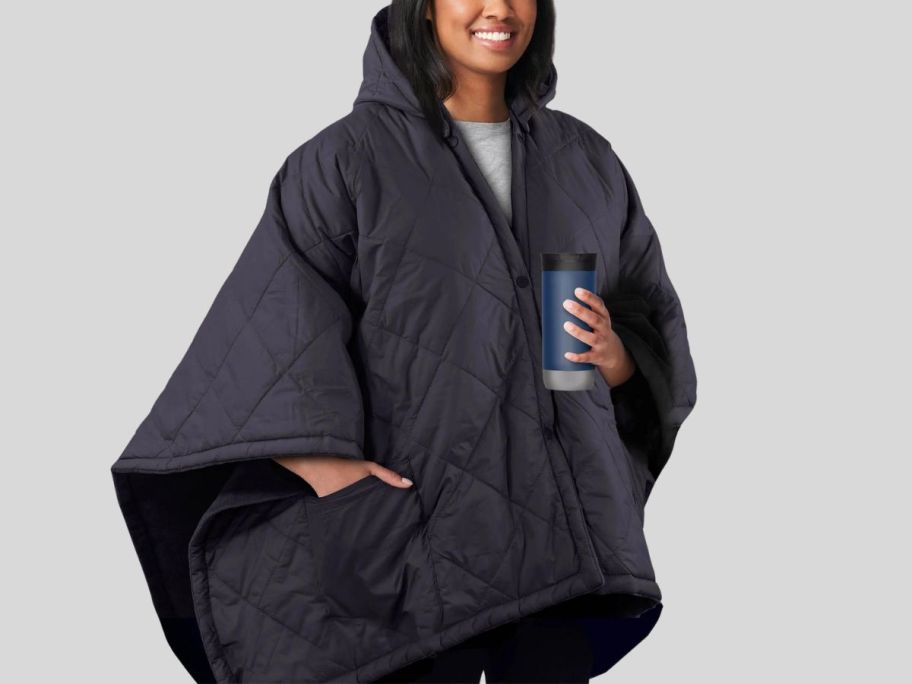 woman wearing Sunbeam On-The-Go Throw Nylon Microplush Cordless 50" x 60" Heated Blanket