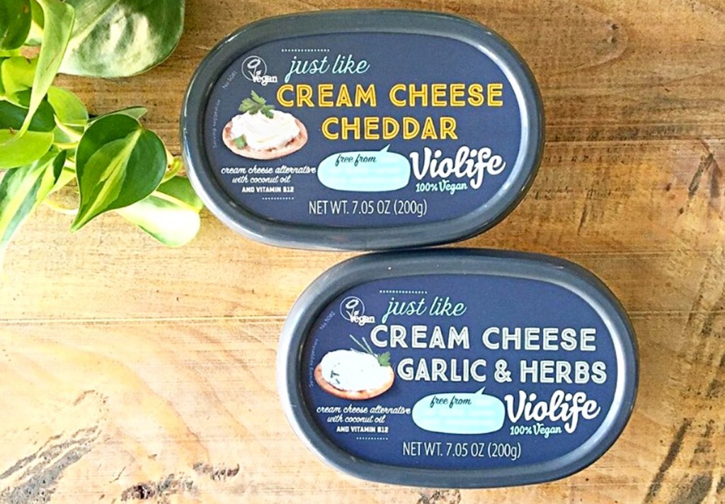 two containers of Violife Dairy-Free Cream Cheese on cutting board