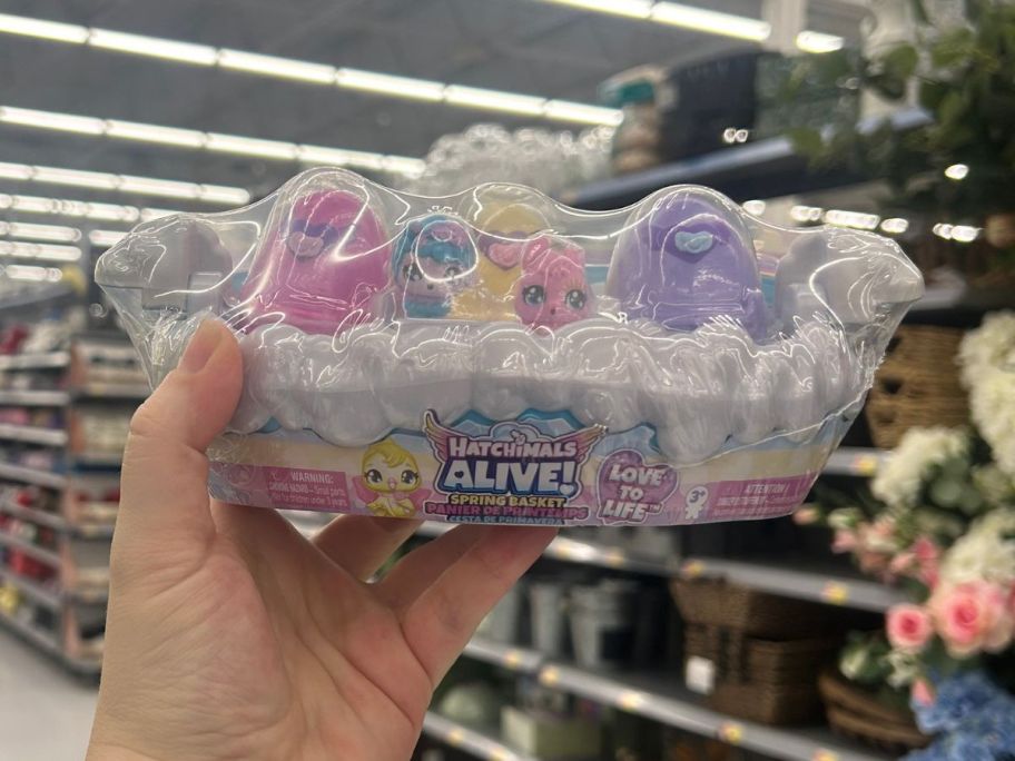 hand holding a Hatchimals Easter Egg Set