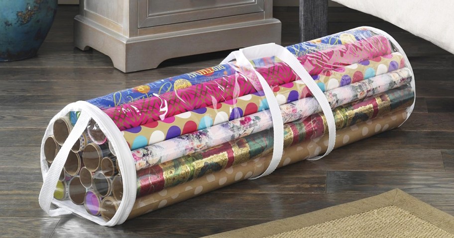 clear wrapping paper organizer filled with rolls of gift wrap