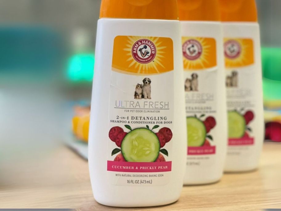 three Arm & Hammer Ultra Fresh 2-in-1 Detangling Pet Shampoo + Conditioner 16oz Bottles on table