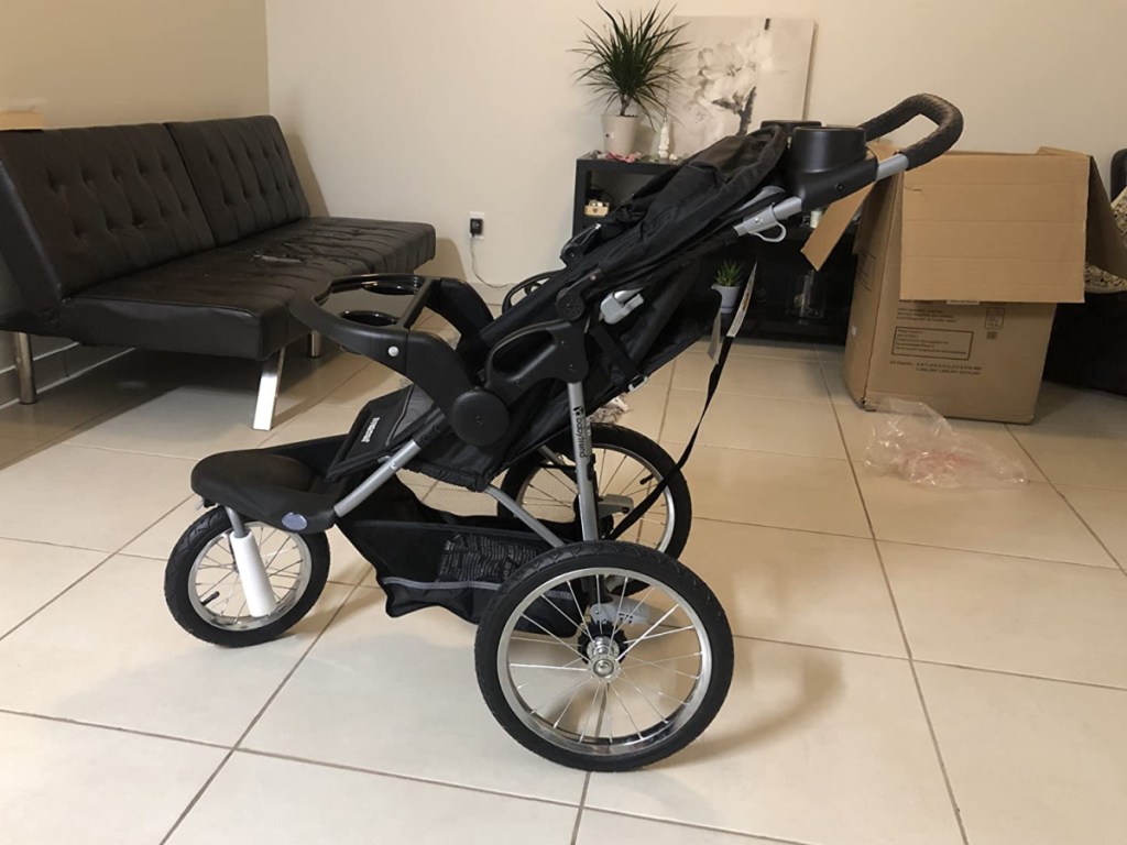 jogging stroller in middle of living room 