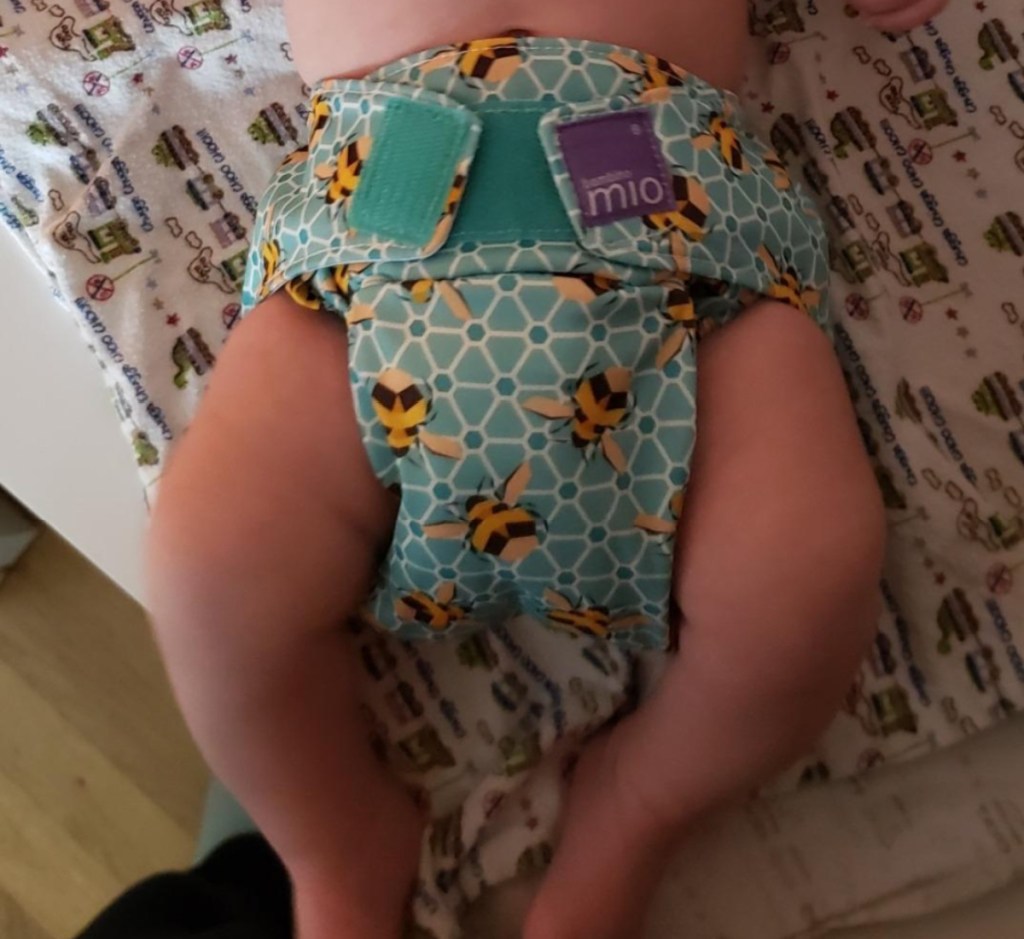 baby wearing bumblebee print cloth diaper