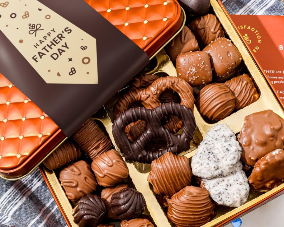 Father's Day gift tin open to show chocolate-covered candies