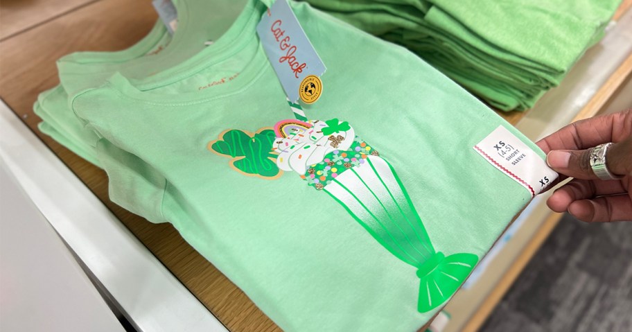 hand pulling green ice cream sundae kids tee off shelf