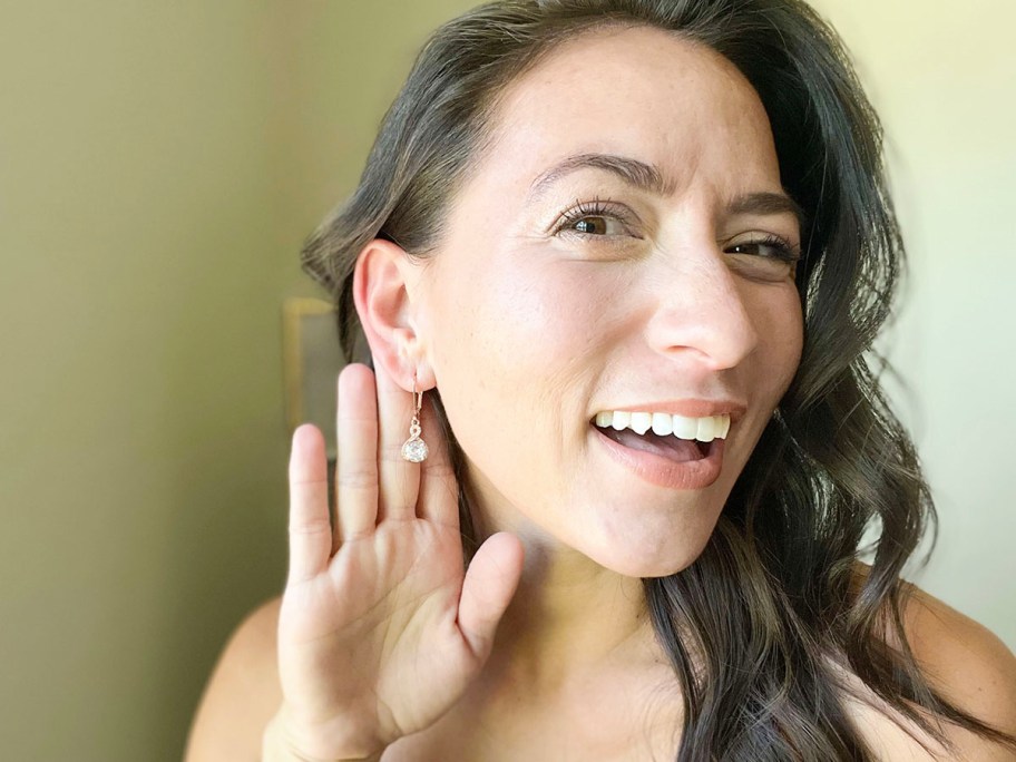 woman wearing diamond drop earrings 