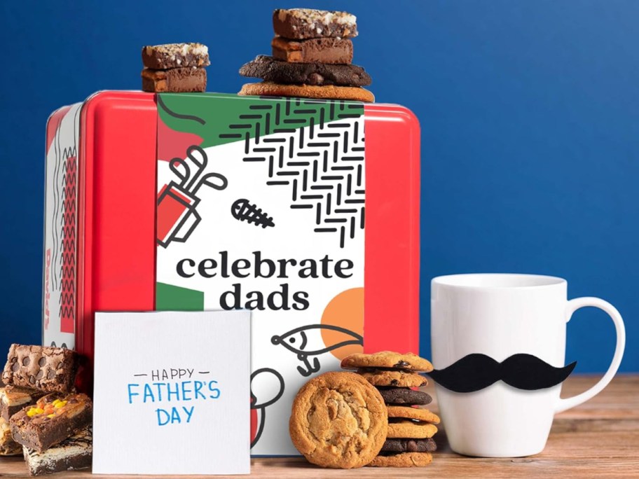 tin of cookies and brownies on a blue background