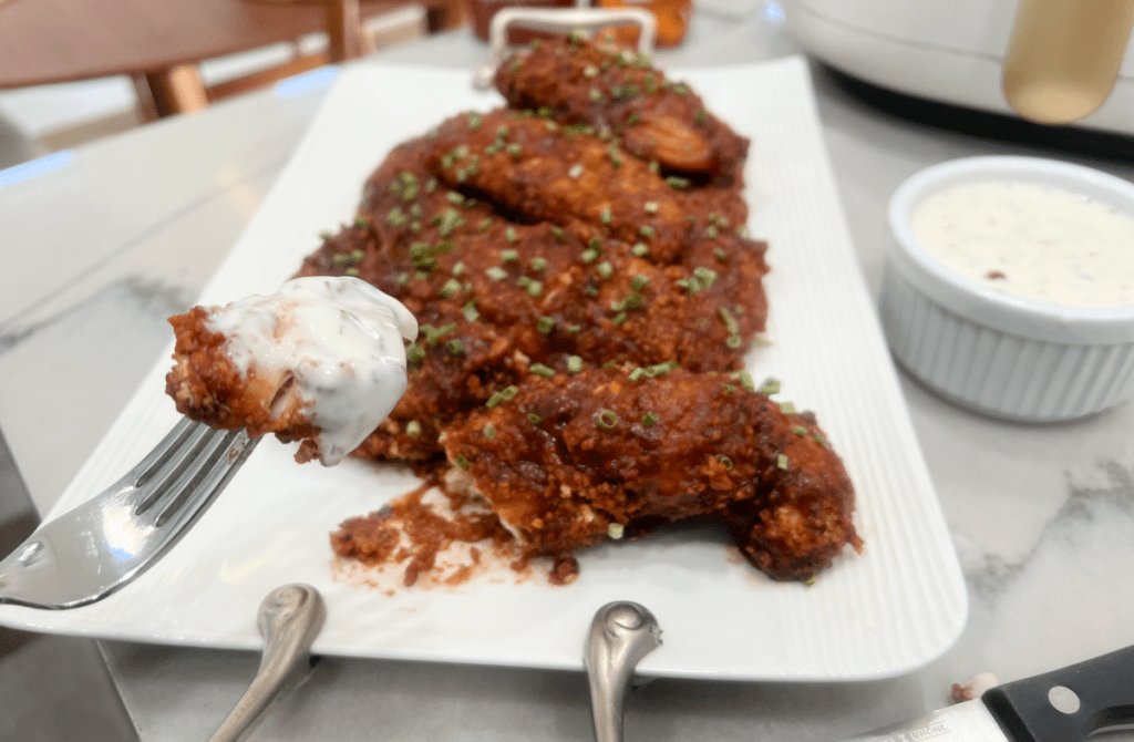 dipping chicken tenders in ranch dressing