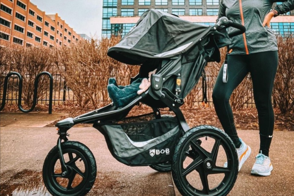 woman running with bob jogging stroller