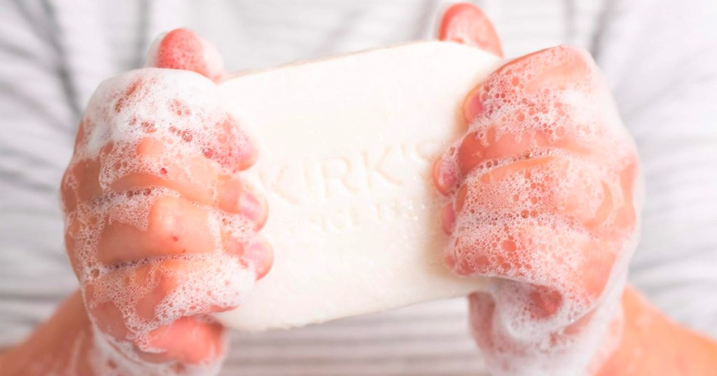 hands holding kirks bar soap 