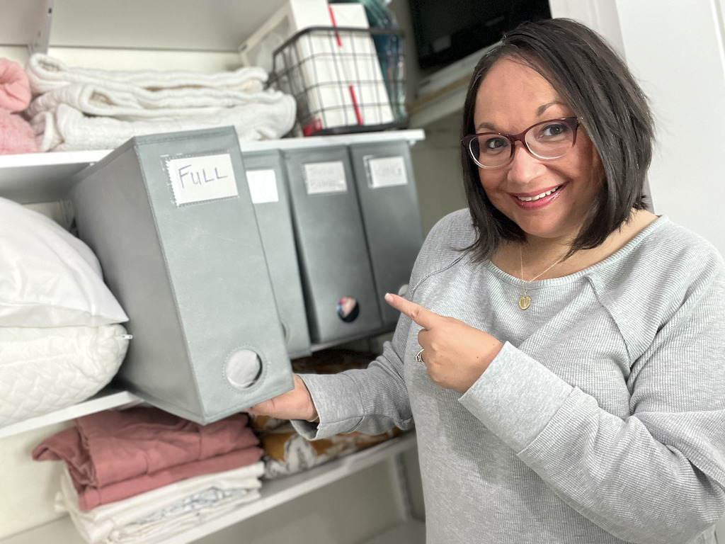 Lina using sheet organizers in closet 