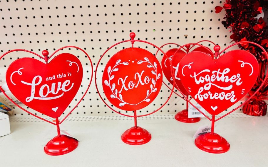 red metal table top decor signs on a store shelf