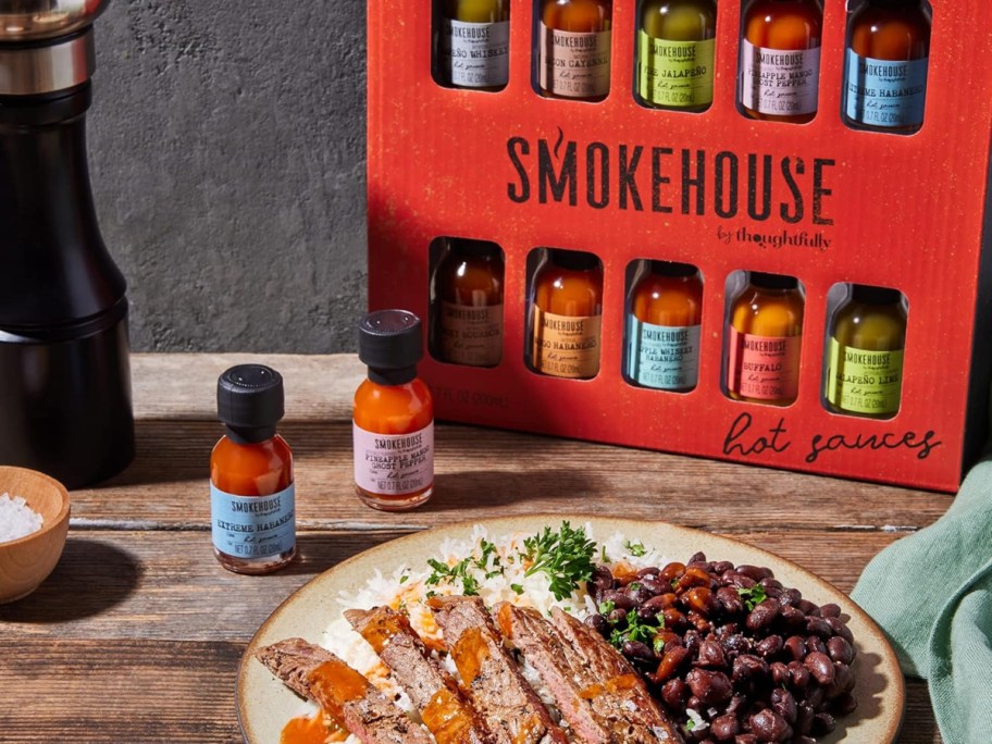 hot sauce gift set next to a plate of food