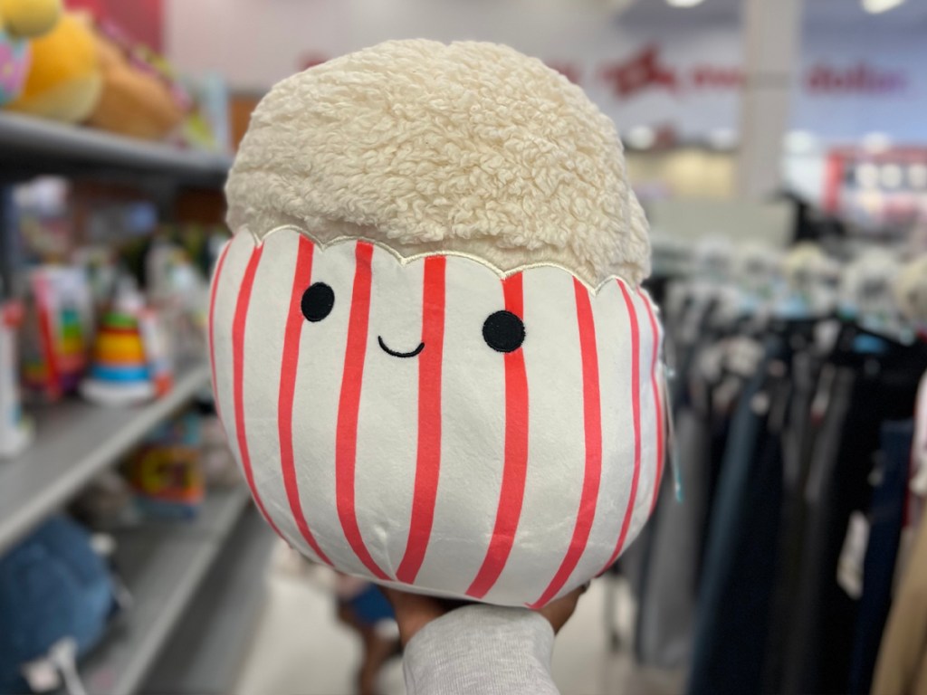 hand holding popcorn squishmallow