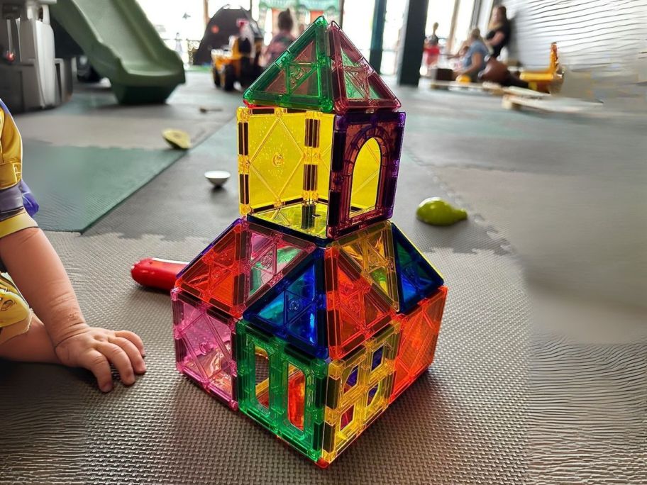 magnetic tiles set built together into a building on table