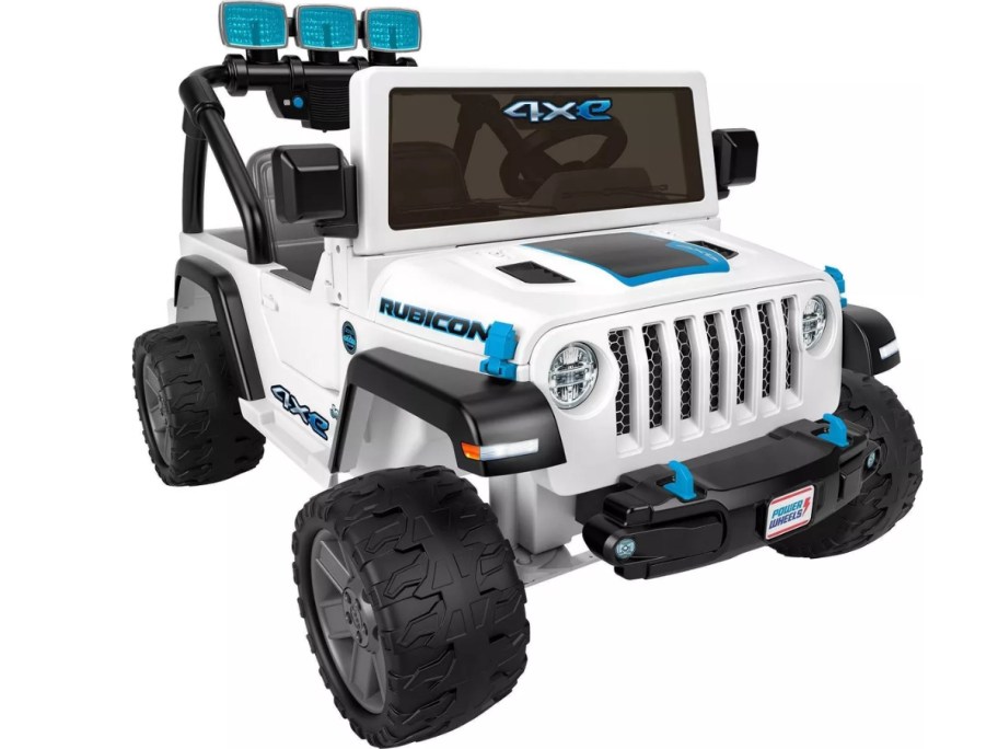 white, black, and blue kid's Power Wheels Jeep Wrangler