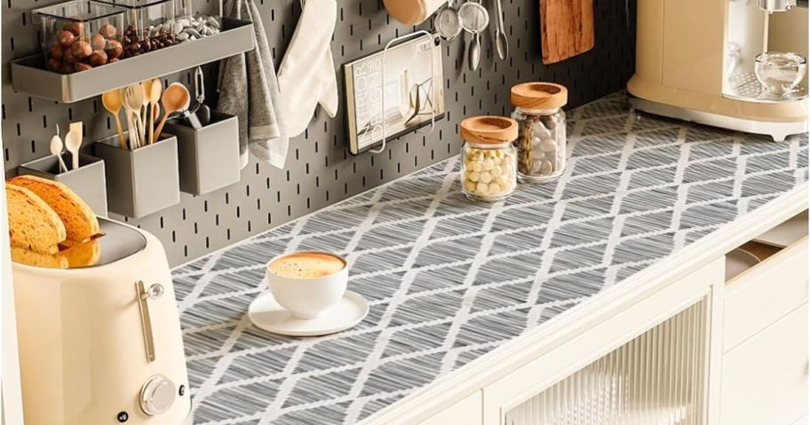 pantry shelf with grey printed design shelf liner and appliances and other items