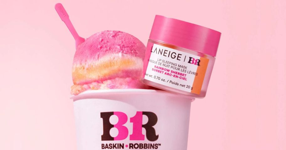 A cup of Baskin Robbins rainbow Sherbet with a scoop jar of Laneige Lip Mask Next to it and a tiny spoon in the ice cream