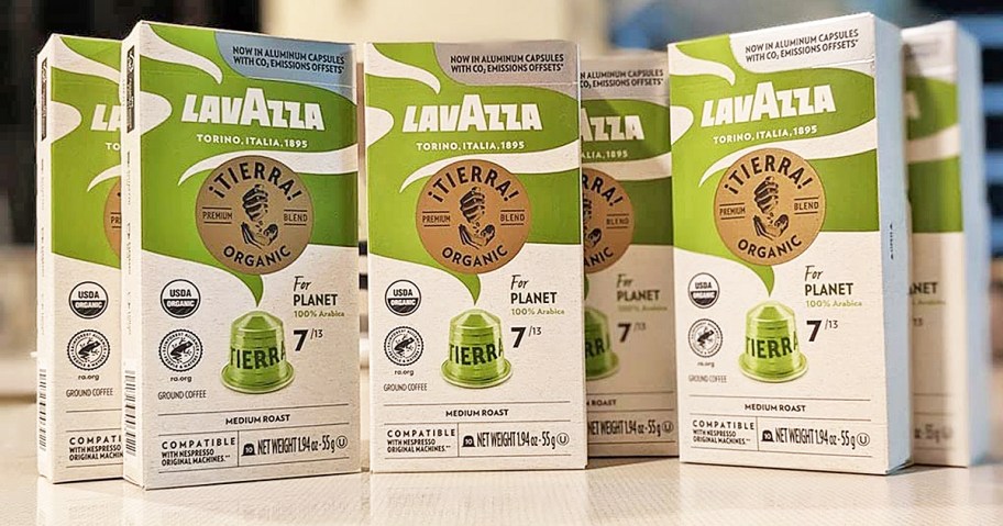 white and green boxes of Lavazza ¡Tierra! Espresso Capsules on counter