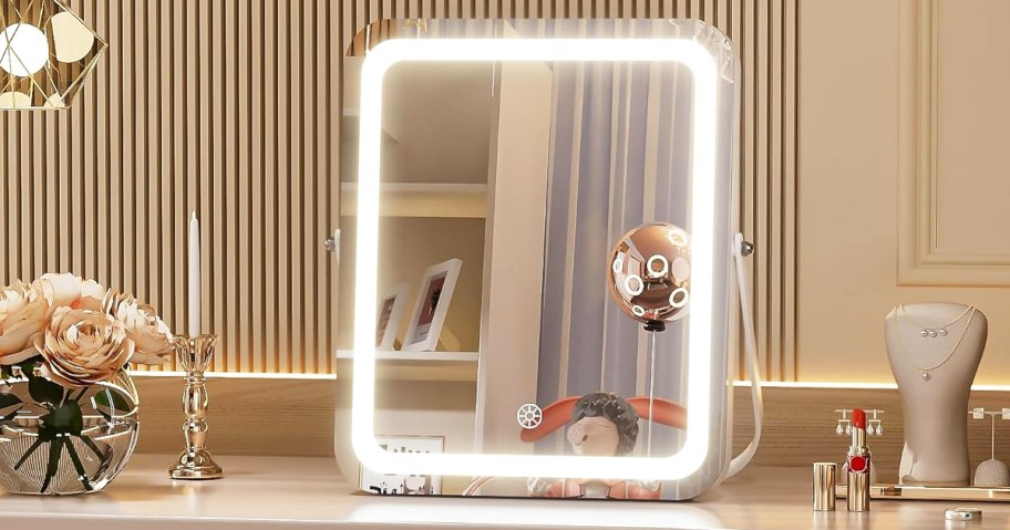 rectangular lighted mirror on vanity 