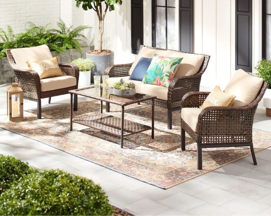 4 piece wicker patio set with beige cushions