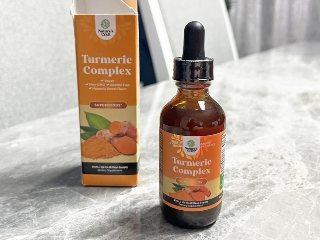 bottle of Nature's Craft Liquid Turmeric on table near it's box