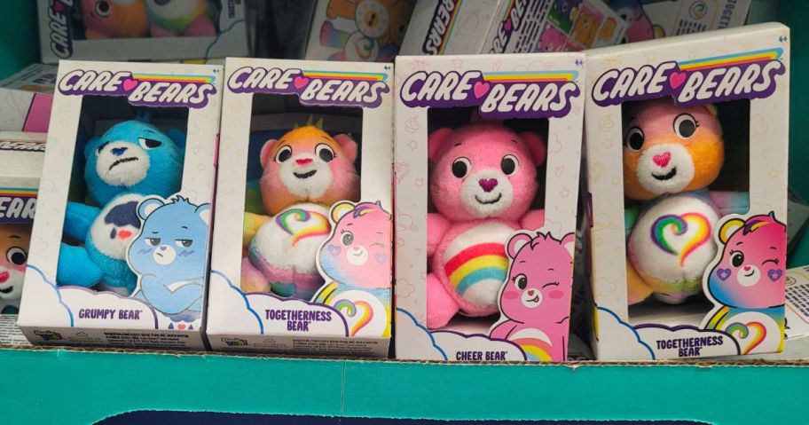 Care Bears Micro Plushes stacked beside each other with more behind them in a bin