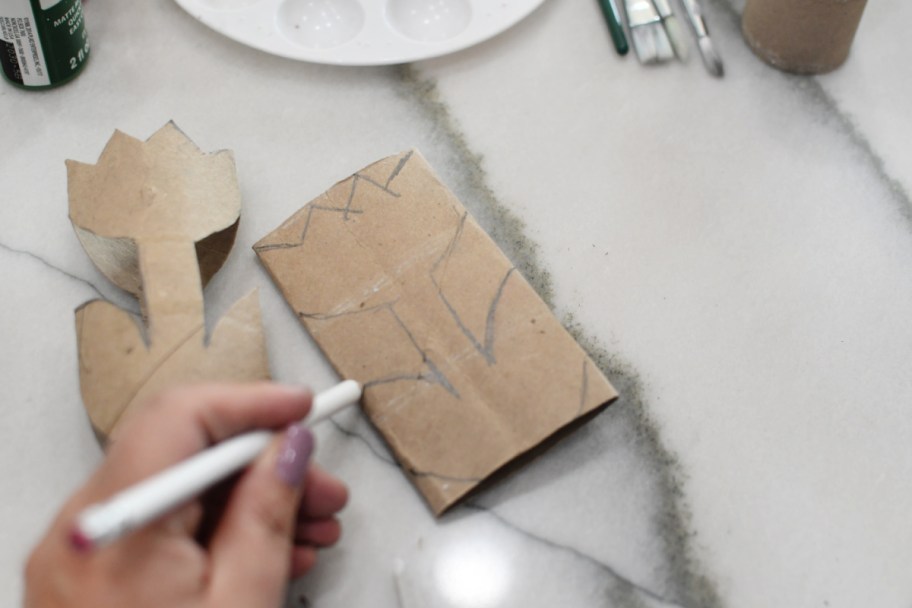 drawing a tulip on a toilet paper roll