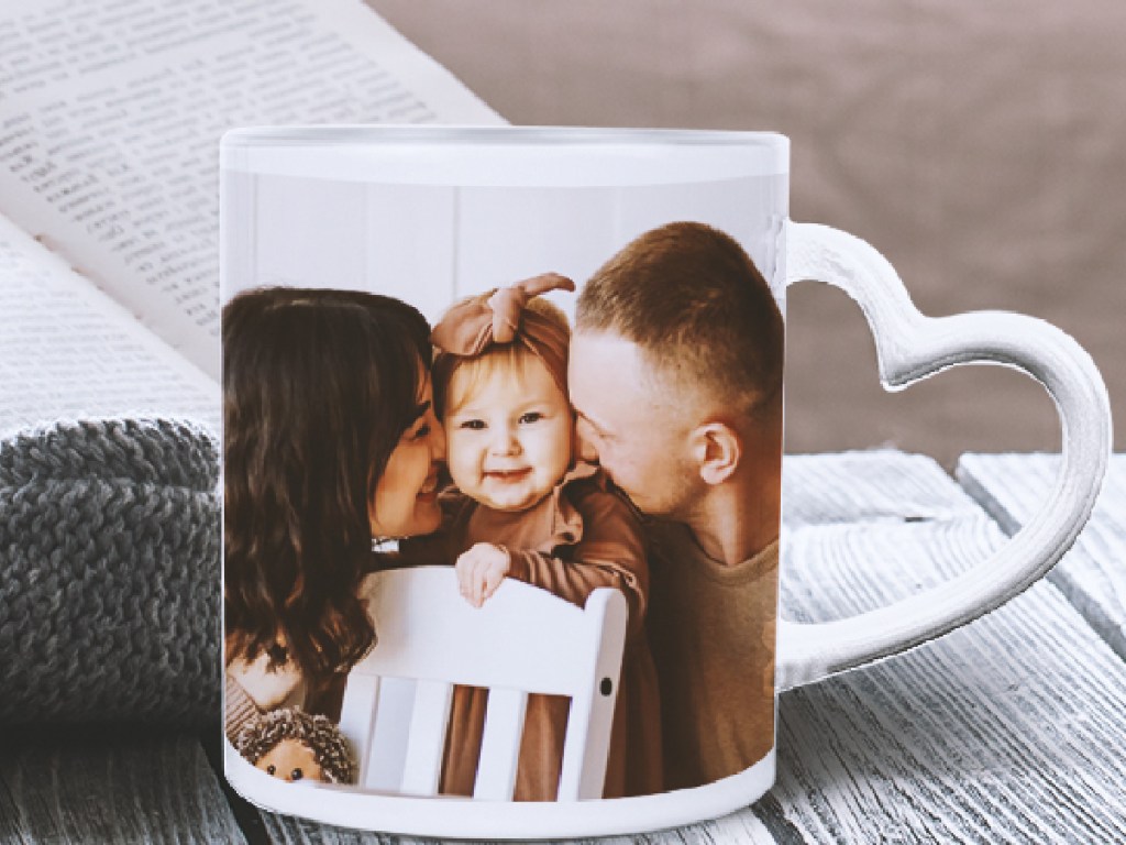 image of family on table with book behind them