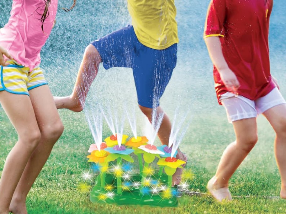 kids playing with flower sprinklers