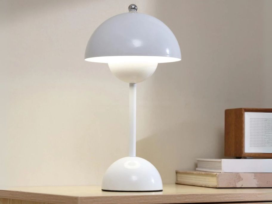 white Mainstays Rechargeable 12" Flowerpot Metal Table Lamp on desk