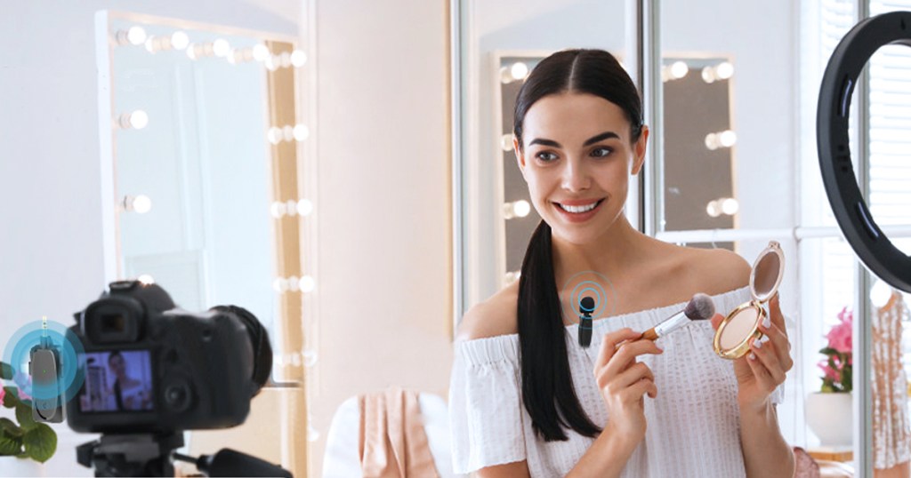 woman filming makeup video using ring light and camera