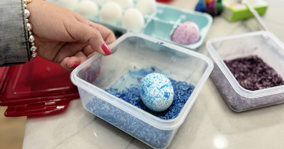 making a speckled easter egg with rice and blue food coloring