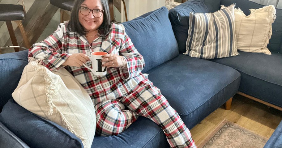 lina sitting on blue couch wearing red, and white flannel pajamas