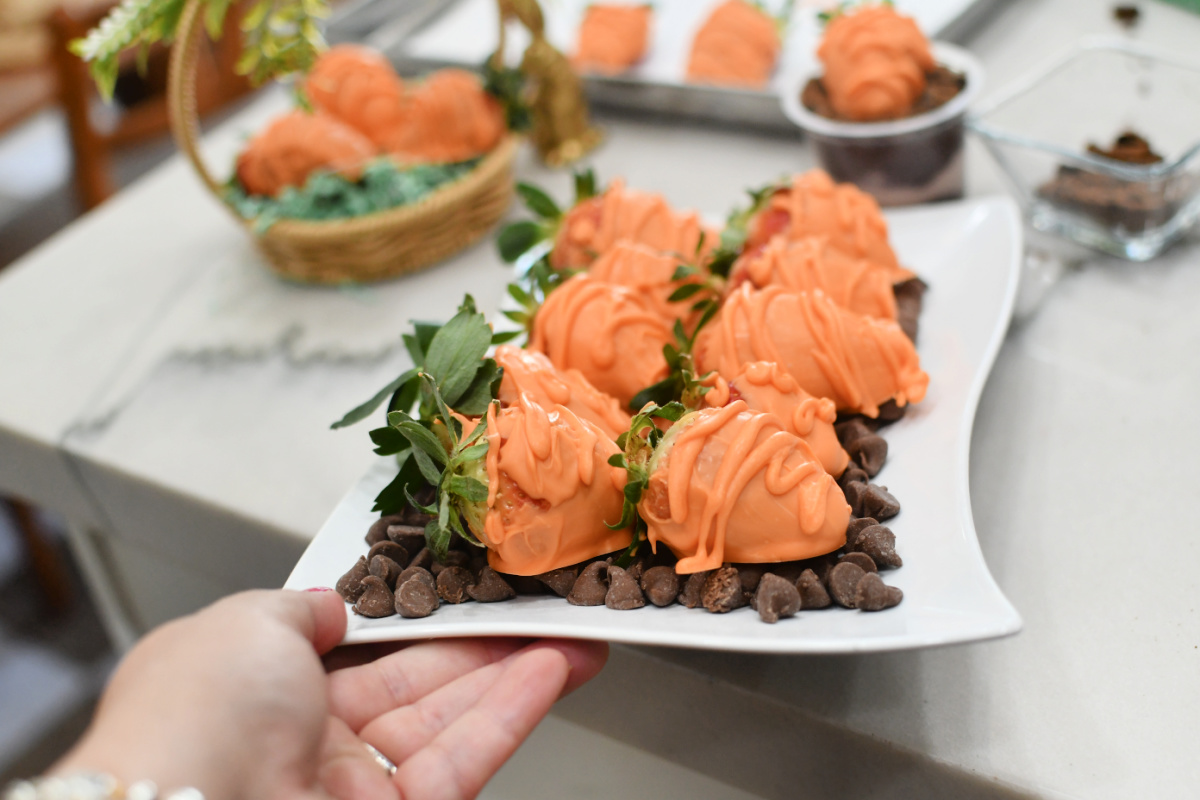 plate with chocolate chips and chocolate dipped strawberries