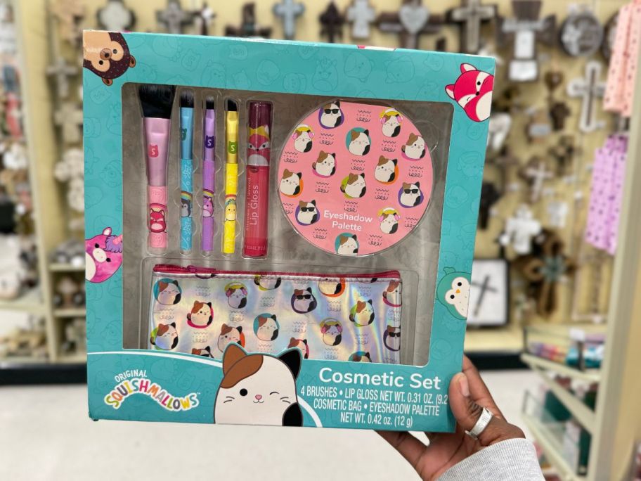 hand holding a Squishmallows cosmetic set in box