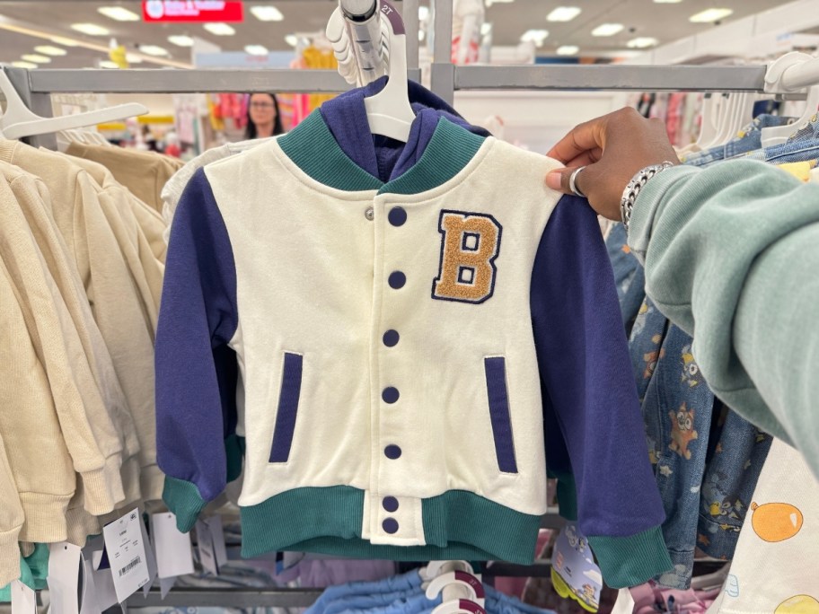 a toddler's Bluey Hooded Varsity Jacket on display at Target