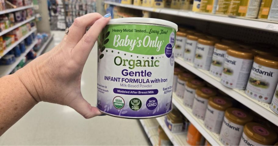 Amwoman holding a Baby's Only Organic Gentle Infant Formula canister