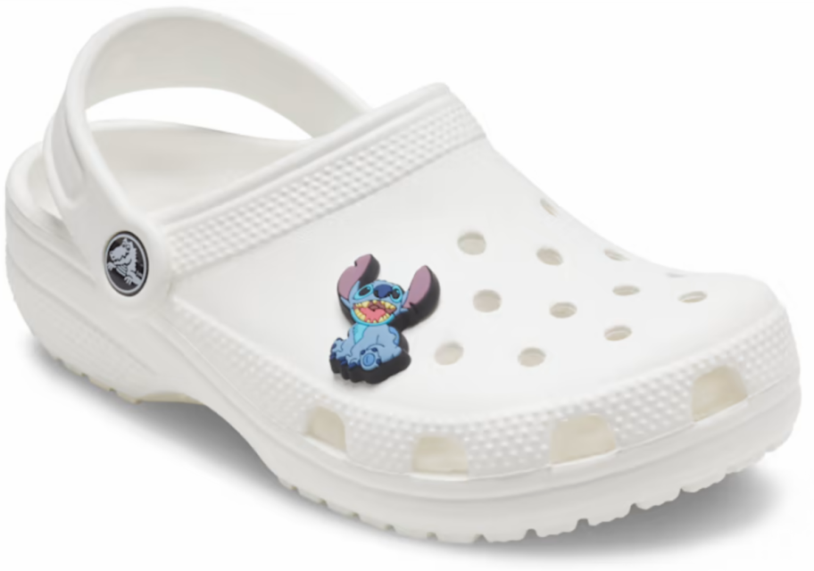 A disney Stitch Jibbitz Charm on a clog shoe