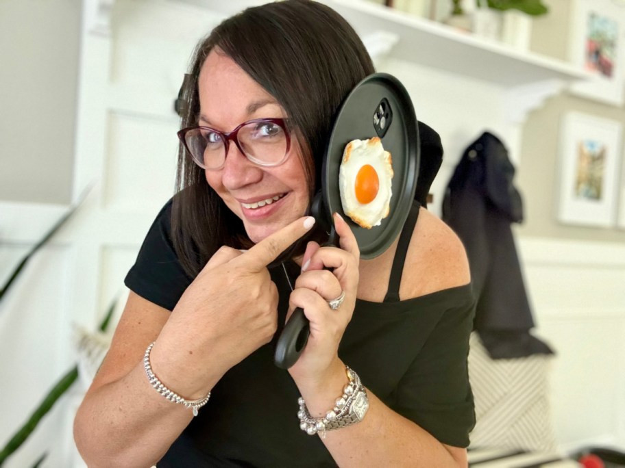 woman holding up her frying pan phone case