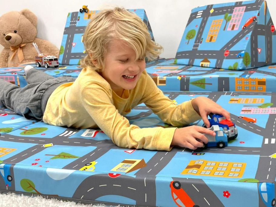A child playing on a Imaginarium Kids and Toddler Play Couch, Road Map