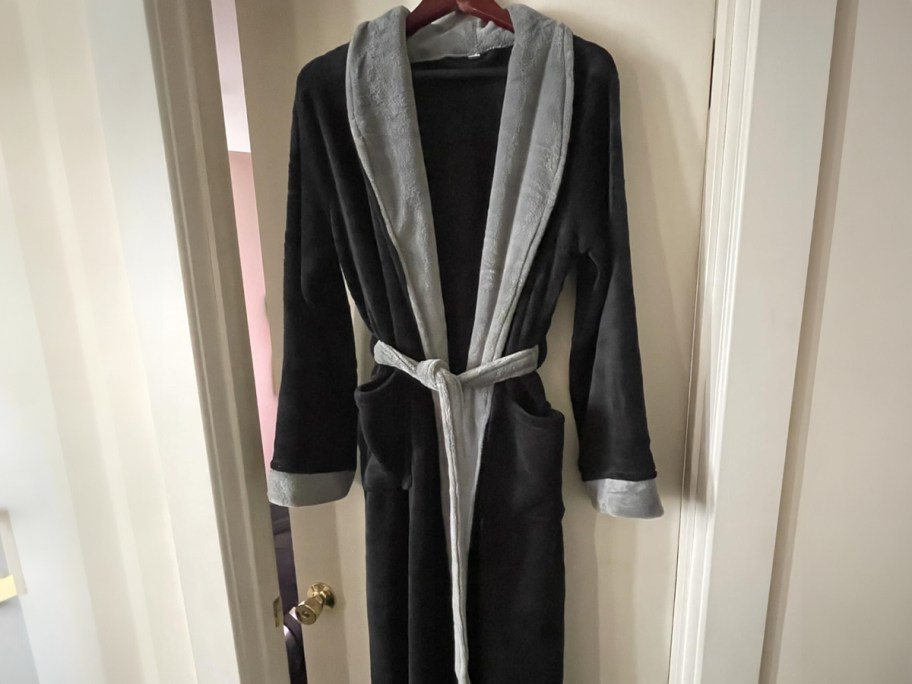 NY Threads Men’s Fleece Robe hanging on a door