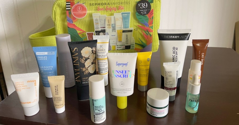 sephora sun kit with products laid out on counter