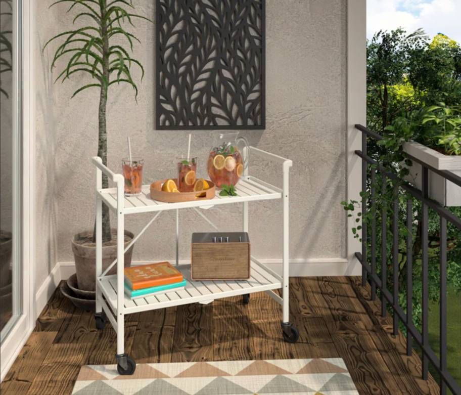 white metal bar cart on balcony