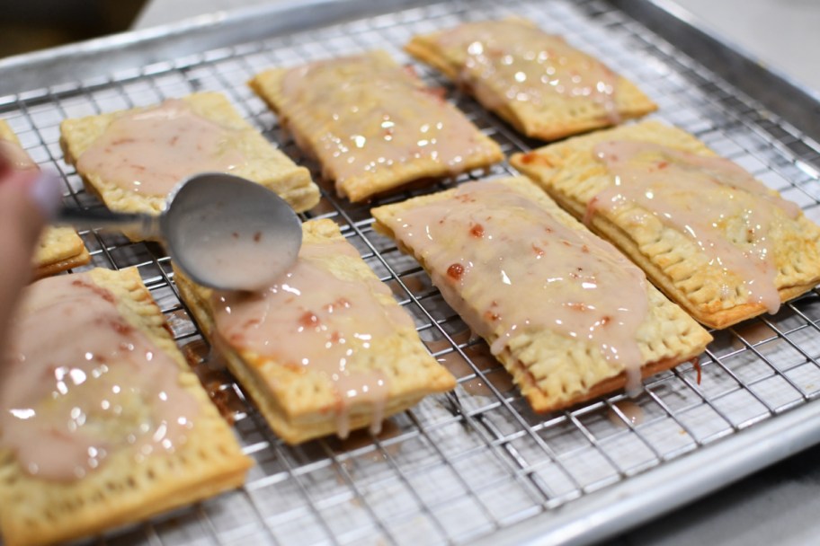 adding glaze to homemade pastry pop tarts